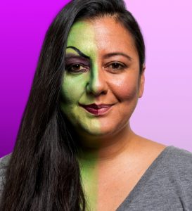 Woman with witch makeup on half of face