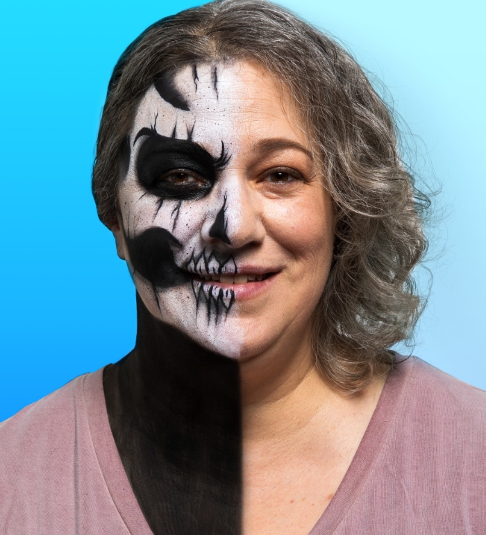 Woman with skull makeup on half of face